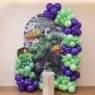 Hulk Birthday Background With Green And Purple Balloon Arch And Comic Art.