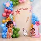 Pastel balloon bunches, seashell detailing and birthday name at top of display.