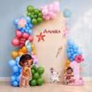 This Moana-themed birthday backdrop includes custom tropical panels, colourful balloon designs and Moana character decorations.