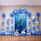 Complete Aquaman colour-tone birthday display with towering columns of balloons, superhero graphics and underwater theme.