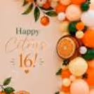 Fresh fruit celebration display layered balloons, leafy accents and orange slice decor added to birthday panel