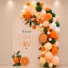 Fresh citrus-themed colourful birthday photo corner for the celebration.