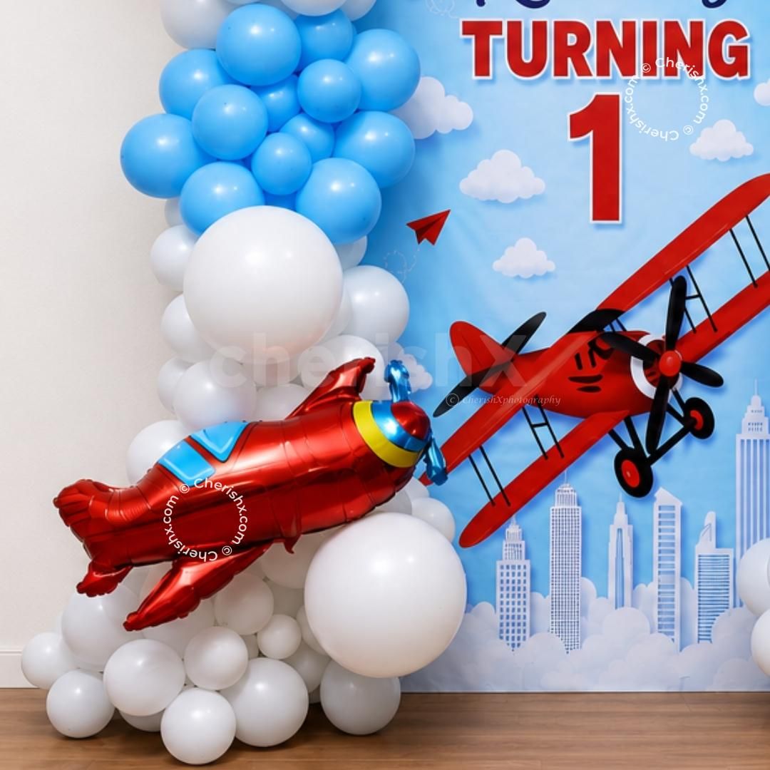 Balloon backdrop with cutout of flying airplane and cloud theme design.