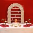 MDF Golden arc with intricate lace work and pearl tassels for Ganpati celebrations.