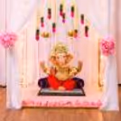 Ganpati idol embedded in a fancy felt cube, with warm lights.