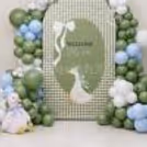 Full shot of Little Goose baby welcome decor with a personalised backdrop and a beautiful balloon arch.