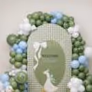 Cute duck sun board cutout for baby welcome celebration along with pastel balloon arrangement.