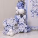 Pastel balloon arrangement with baby elephant cutout.