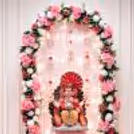 Beautifully placed with flower petals and fresh blooms at the base of the decorative setup.