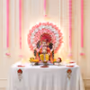 Artificial pink and white round rose decoration background with warm LED lights and hanging pink flower garlands for diy.