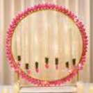 The kit has a lotus theme ring backdrop, artificial jasmine lotus garlands, MDF lotus decorations, Fairy lights and a festive pooja wall.