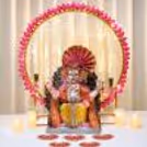 Lotus Theme DIY Ganpati Decoration Backdrop with 3x3 feet floral ring stand, hanging jasmine lotus strings, warm fairy lights, and Ganpati pooja.