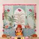 Peacock Theme Traditional Ganpati Backdrop with best peacock design flex backdrop, Pink floral garlands, Lotus strings and festive pooja decoration.