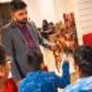 A children’s birthday party with a professional magician performing interactive magic and a temporary tattoo shop.