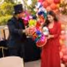 Premium adult magic show with a magician performing close-up magic and engaging the audience.