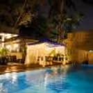 Beautifully decorated cabana with rose petals and candles for an anniversary celebration in Bangalore.
