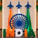 Ashoka Chakra stand, tricolour fabric backdrop, and aeroplane theme decoration for the Patriotic Independence Day.