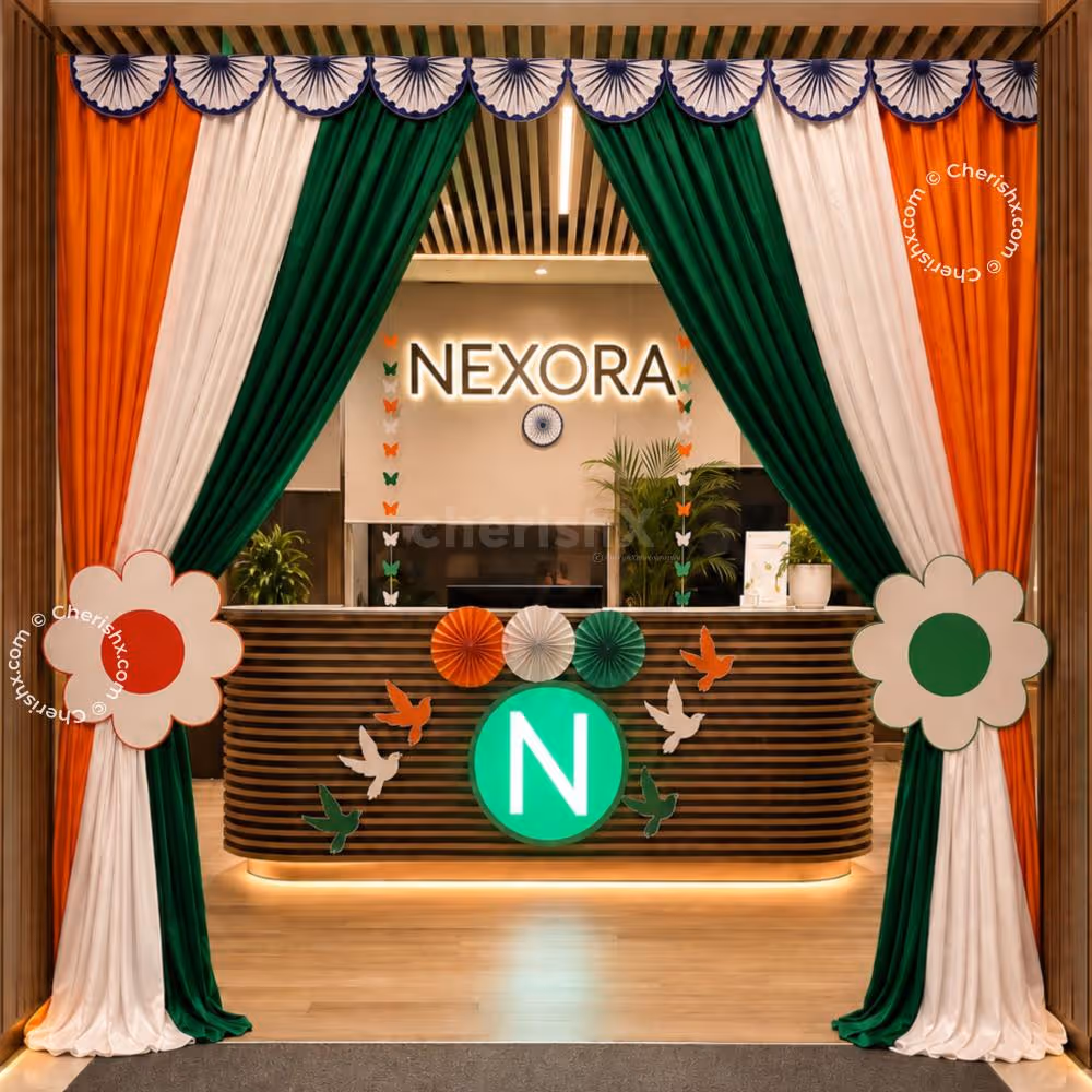 Saffron, white and green satin drapes, Ashoka Chakra decorations and floral cut-outs on Independence Day Tricolor Entrance Decoration.
