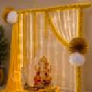Craft your sacred space with our carefully designed decoration stand adorned with golden bells, fragrant flowers, and charming pom-poms.