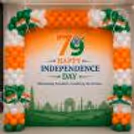 Patriotic flex banner, tricolour balloons and paper flag decorations for 79th Independence Day-related office celebrations.
