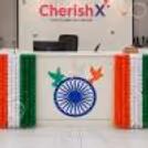 For an office Independence Day celebration, the reception desk is adorned with tricolour flower garlands, Ashoka Chakra artwork and patriotic butterflies.