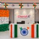 Balloon bunches, paper roses, Indian flags, festive Independence Day decorations in the corporate reception area.