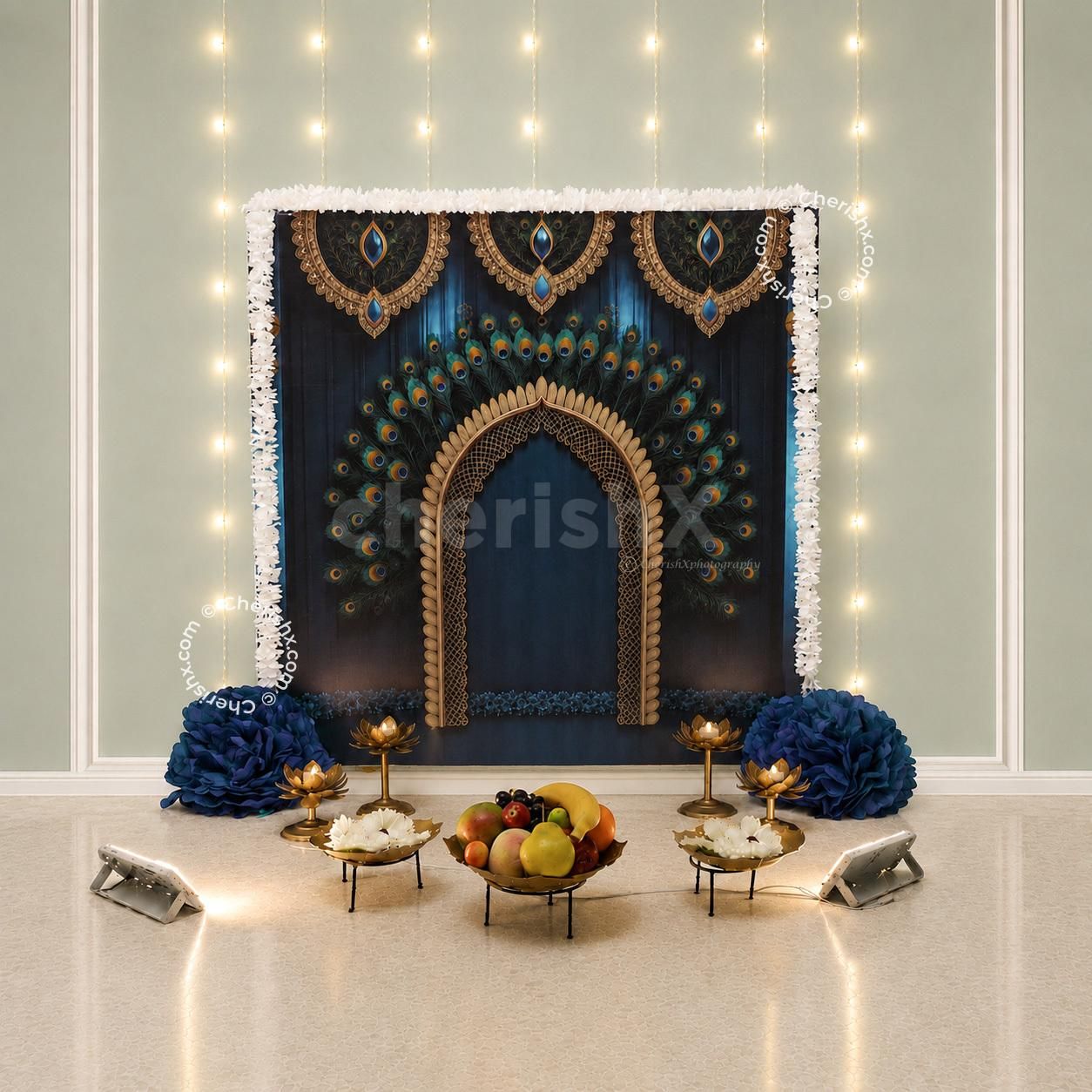 Beautiful Ganpati DIY backdrop with a peacock design along with decorative garlands and festive setup for home celebrations.