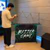 A corporate event with a professional game setup for the Electric Buzz Wire Game.