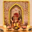 The decoration of the traditional Ganesh Chaturthi is done with the full setup of Ganpati in the backdrop and Peacock Flex and Yellow Floral Arch.