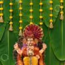 DIY Ganpati Wall with Banana Leaf, Yellow Marigold Garlands Around The Festive Setup