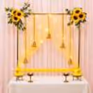Yellow Sunflower Ganpati Decoration with Flower Corner Decorations and lit-up backdrop.