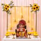 Golden Frame Ganpati Backdrop Yellow Artificial Garland & Traditional Bell Hanging