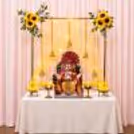Bell Hangings and Golden Stand with Yellow Flower and Fairy Lights Sunflower Ganpati Backdrop Decoration.