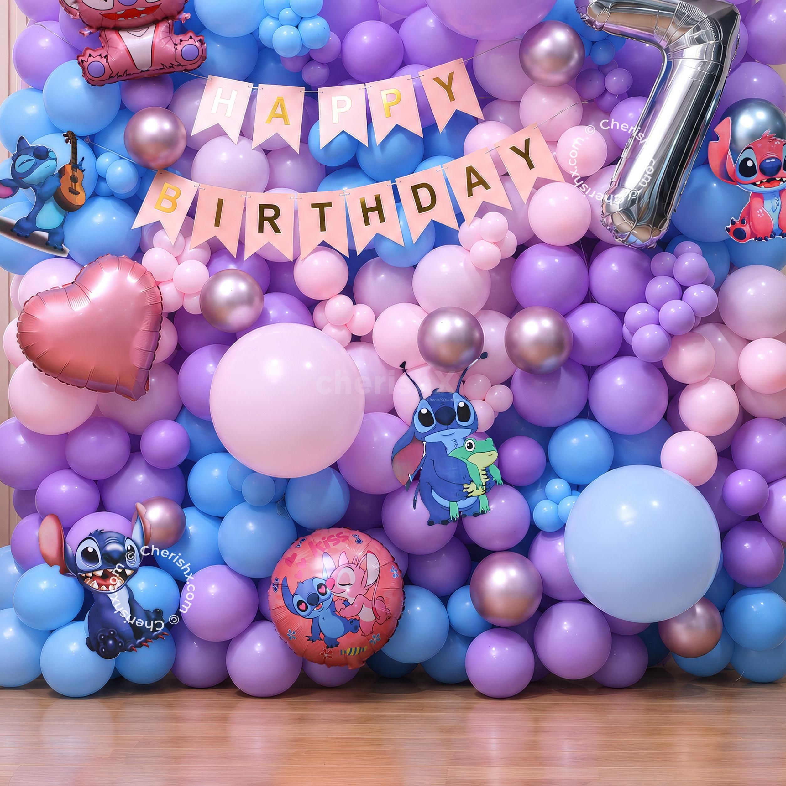 Make Stitch Theme Birthday Decoration by using macaron balloons, Angel foil balloons, and a colourful birthday backdrop.