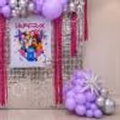 K-pop birthday wall decor with Huntrix poster and silver background for partyK-pop birthday wall decor with Huntrix poster and silver background for party