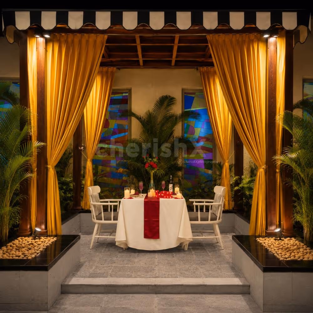 Private cabana candlelight dinner with romantic table decoration for couples