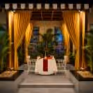 Private cabana candlelight dinner with romantic table decoration for couples