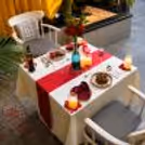 Romantic private cabana dining setup with candles, flowers and elegant décor