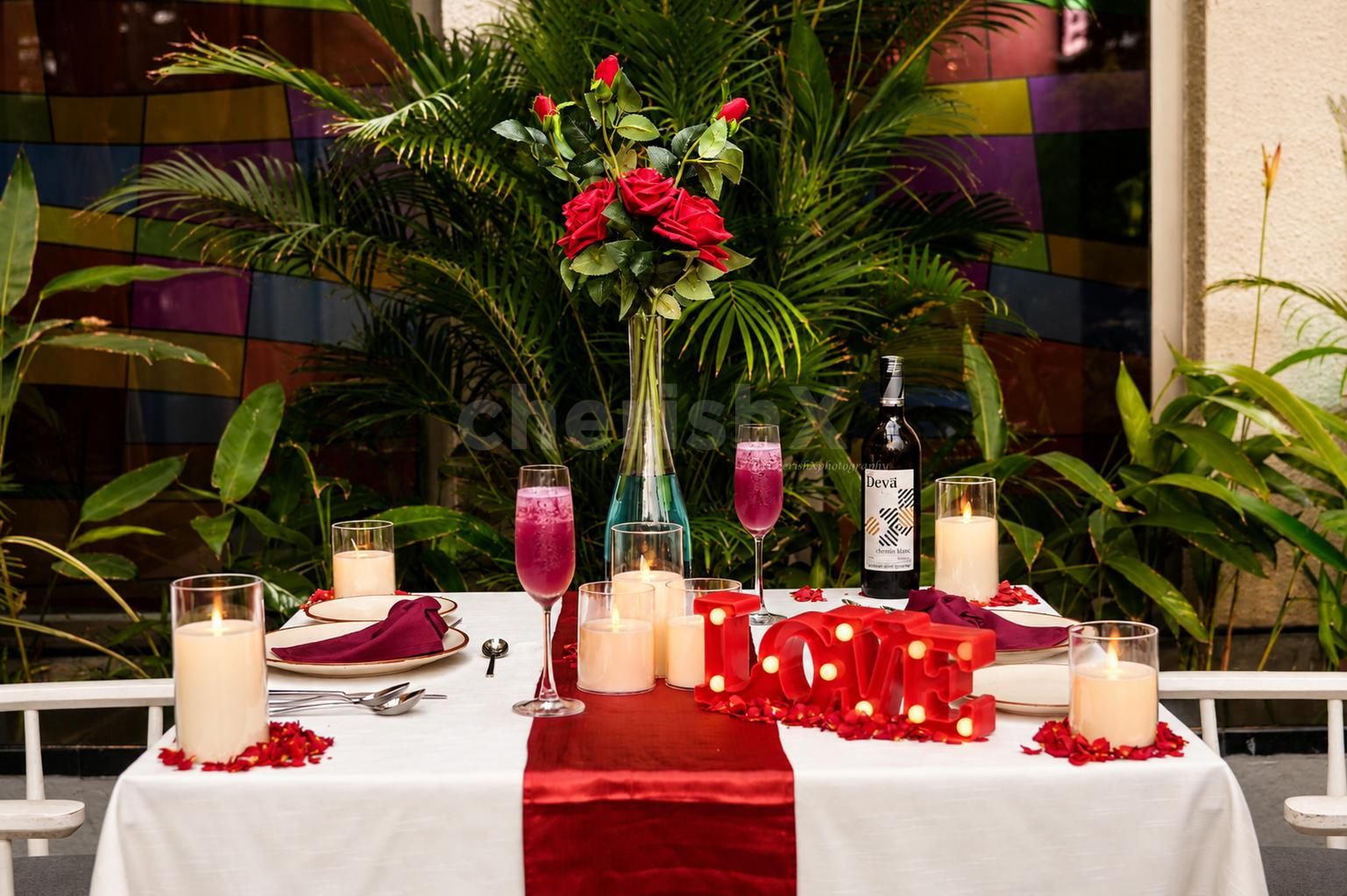 Intimate cabana dining experience with five-course meal, wine and romantic table setup