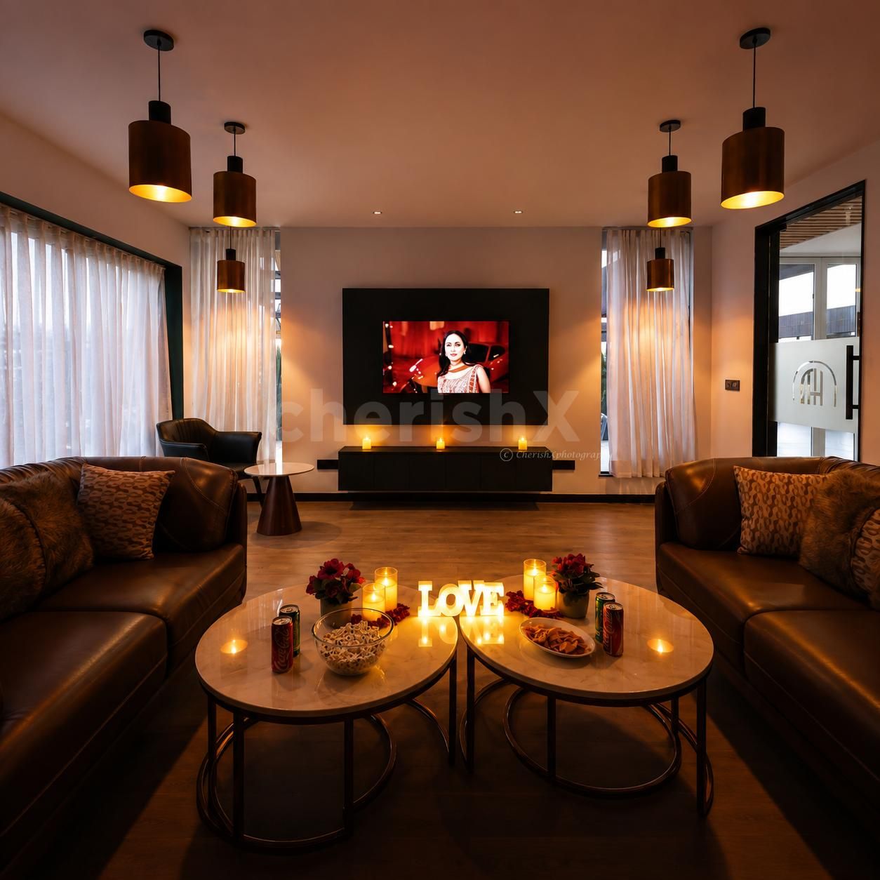 Romantic indoor movie night with decorated table and intimate seating
