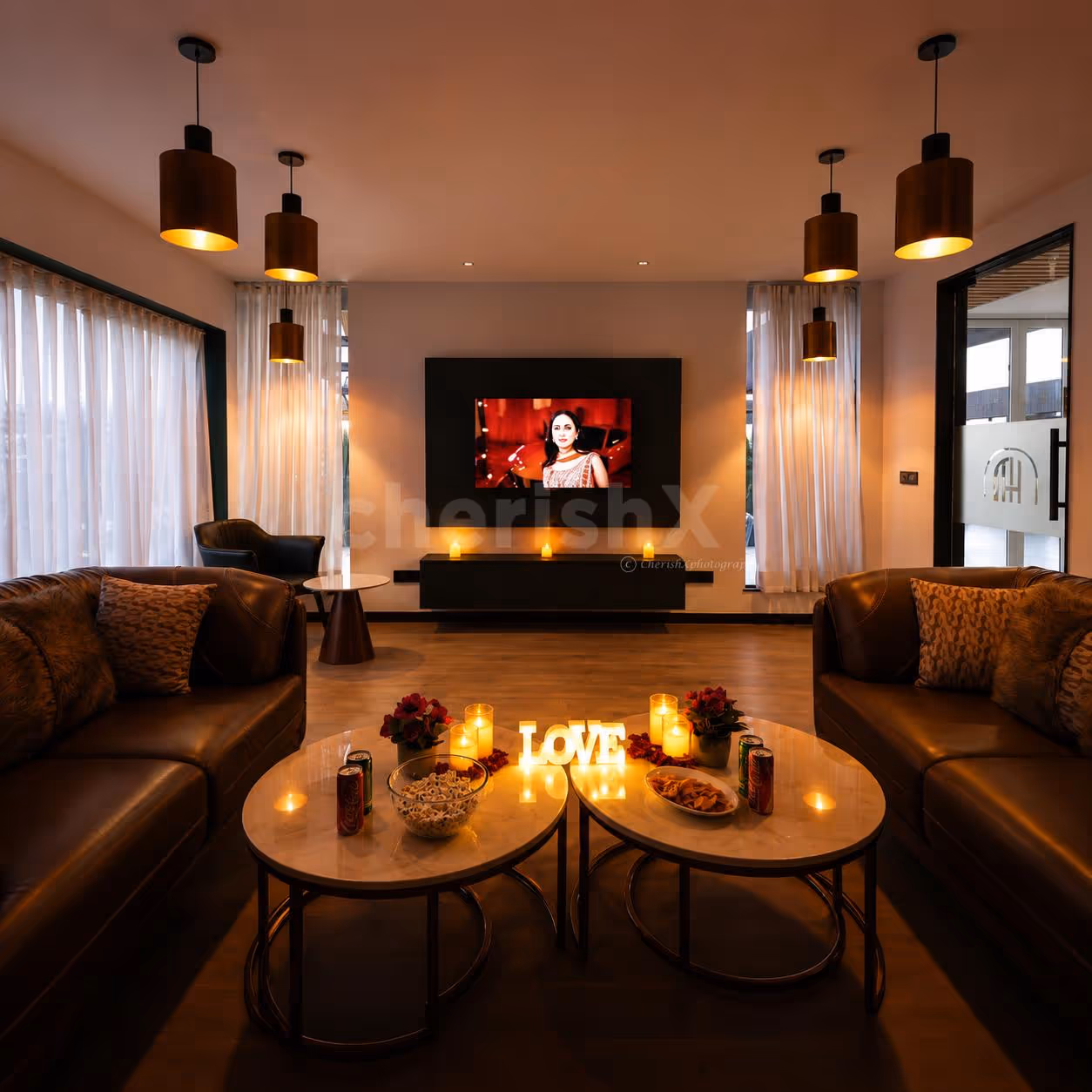 Romantic indoor movie night with decorated table and intimate seating
