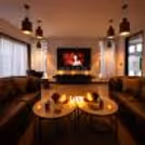 Romantic indoor movie night with decorated table and intimate seating