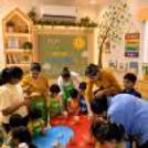 Children paint figurines in different colours in a creative Paint the Figurines birthday activity