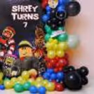Custom Roblox birthday flex featuring a cutout game character and silver age number balloon and colourful balloon decorations.