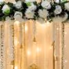 We put floral decorations on either side of the Ganpati as well as traditional decorations at the bottom.