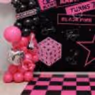 The BLACKPINK birthday decor is designed with a huge star formation, pink balloon sets and silver foil balloons.