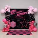 Birthday Backdrop for BLACKPINK with pink and black balloon arch, pink and black flex, checkered floor pattern.