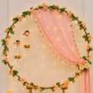 The LED candles in brass lotus holders around the Ganpati pillar enhance the traditional and festive mood.