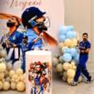 Cricket player-themed background for a personalised birthday celebration, big player picture, colourful balloon and cricket theme styling.