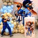 Close-up of a cricket celebration with a Virat Kohli cut-out, personalised birthday flex & balloon arch.